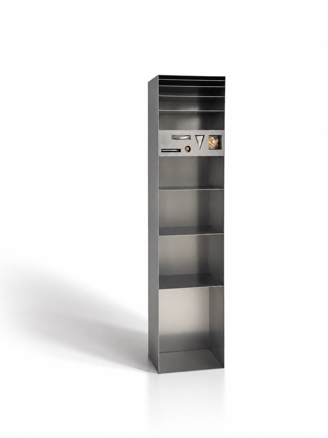 The same column from three-quarters, its deep side panel turned to the light and the specimens in the inset panel reading clearly across it